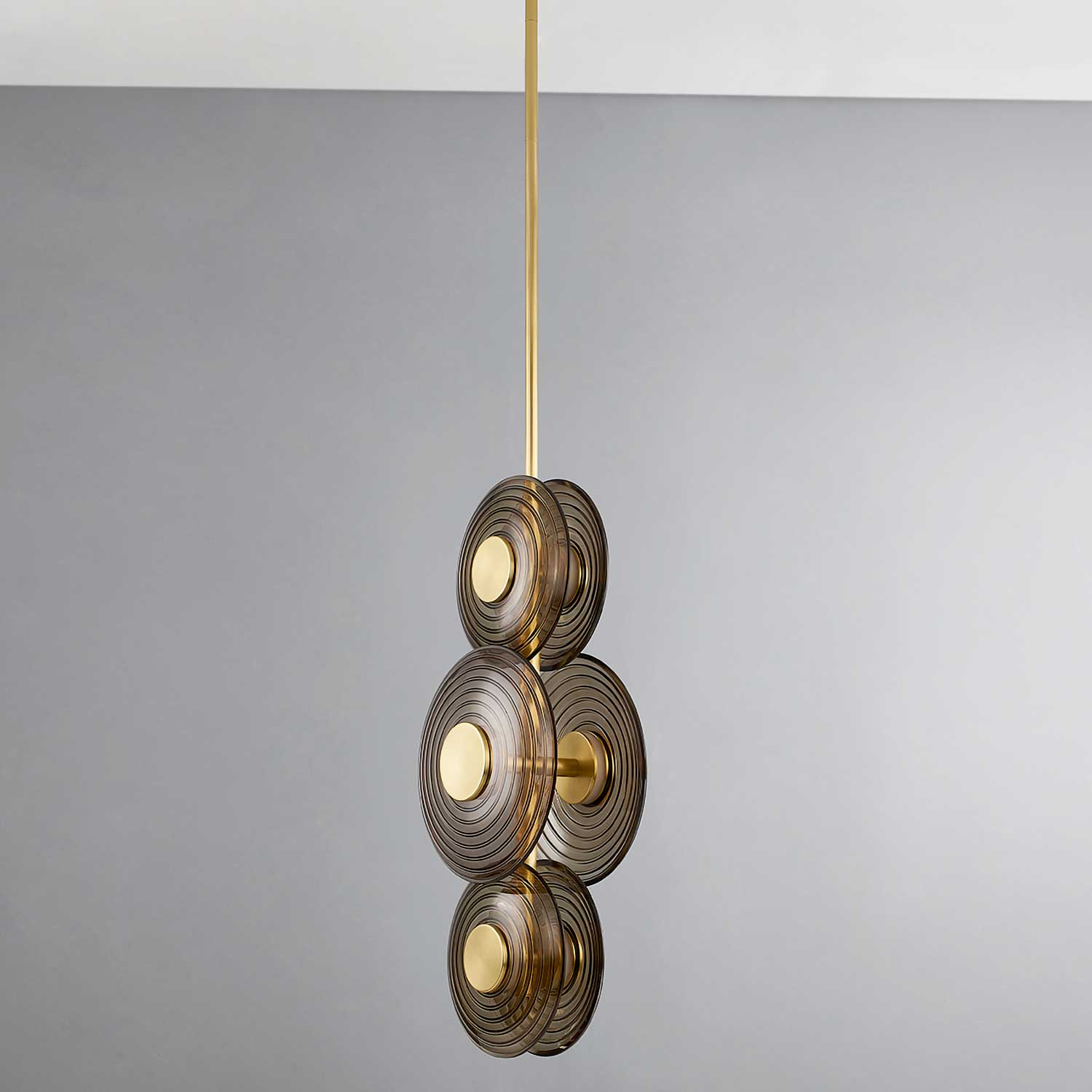 Griston - Modern golden suspension in brass and smoked glass